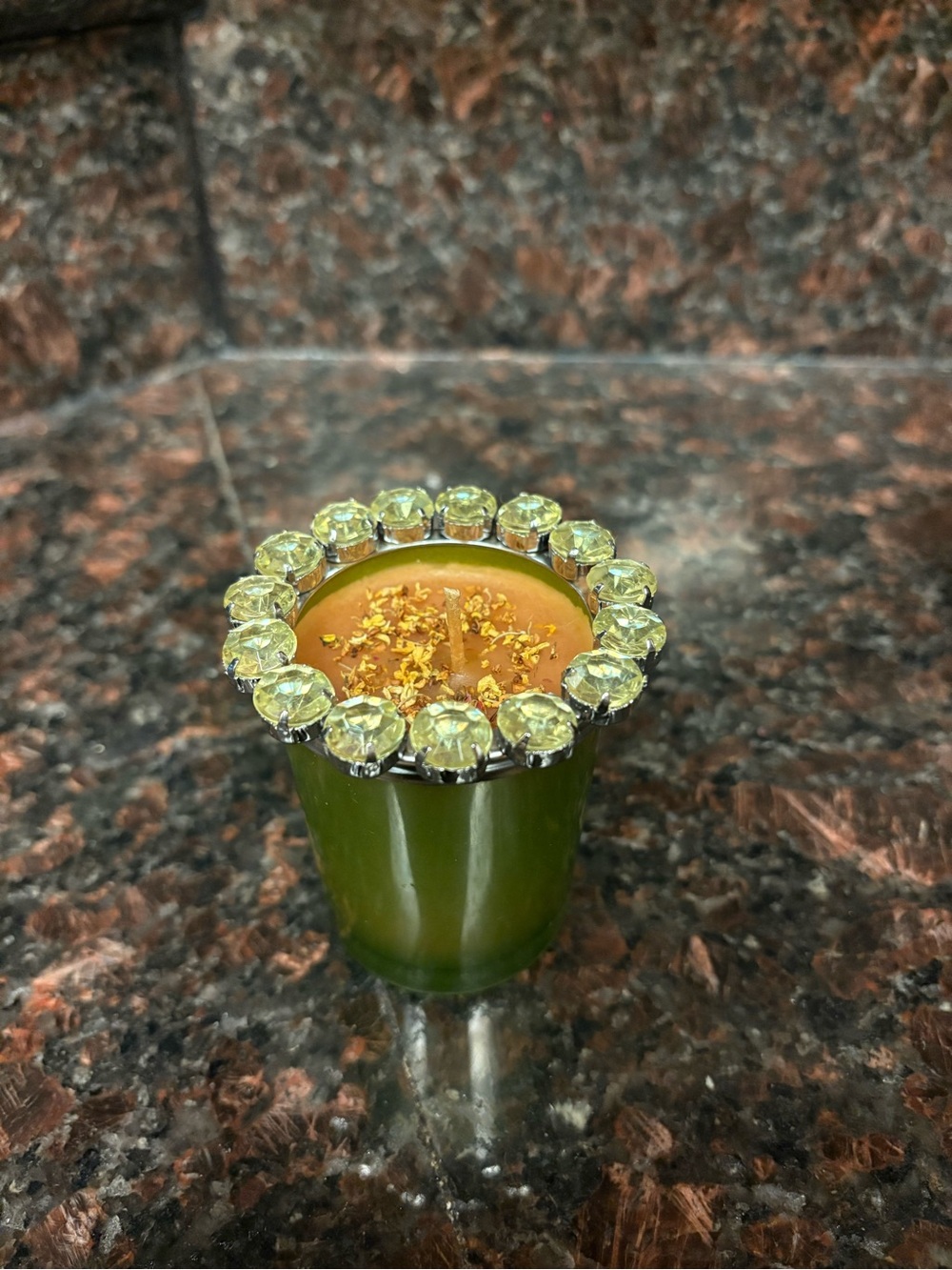 Handmade candle pineapple scented wax poured into a green jar with rhinestones